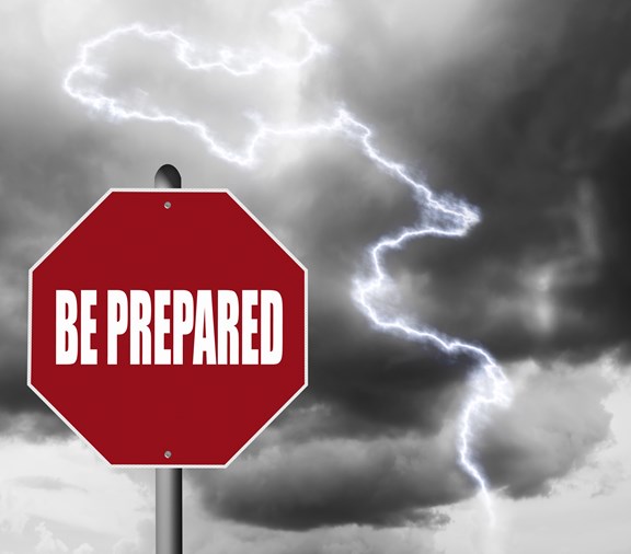 Red stop sign with storm background