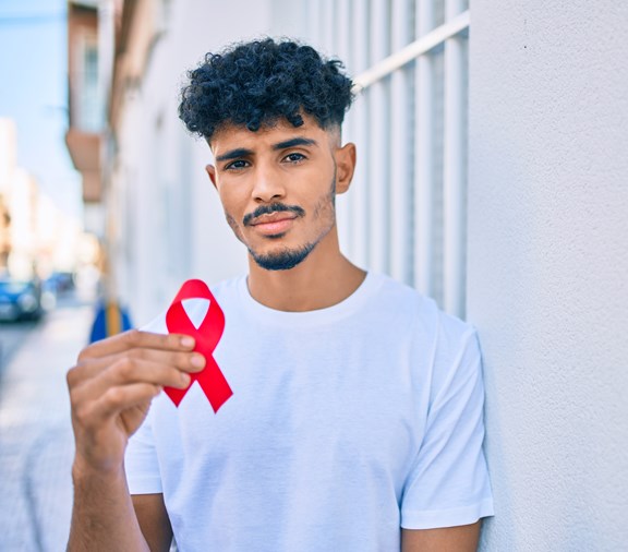 Man with HIV awareness ribbon